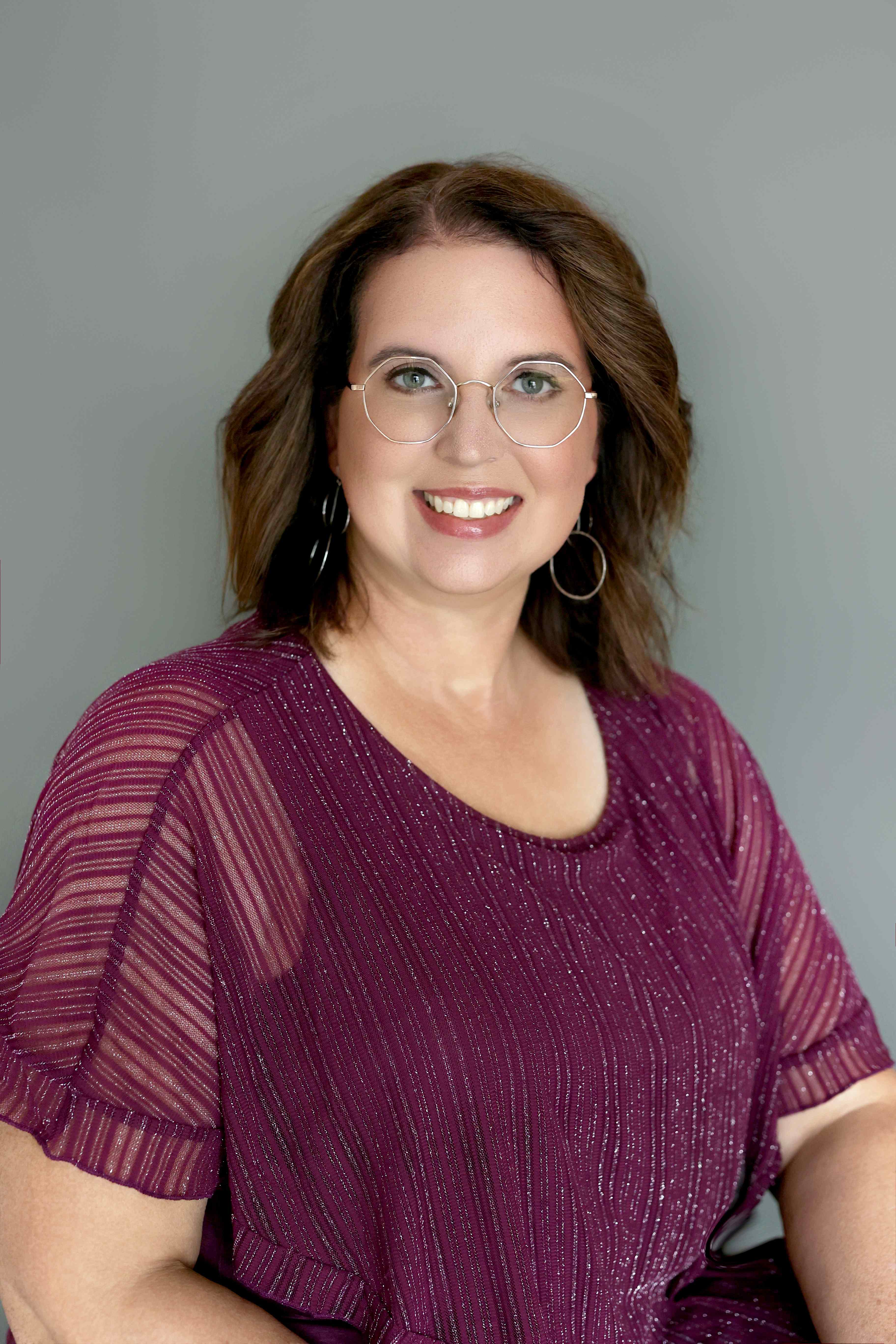 Karen Kay Smith headshot in a burgundy top